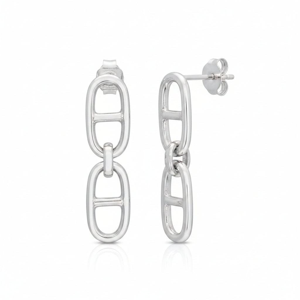 A pair of polished silver drop earrings featuring a vertical oval link design on one earring and a side profile of the other on a clean white background.