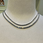 Necklace on a mannequin with a neutral background